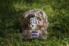"H" LOGO CAMO TRUCKER HAT