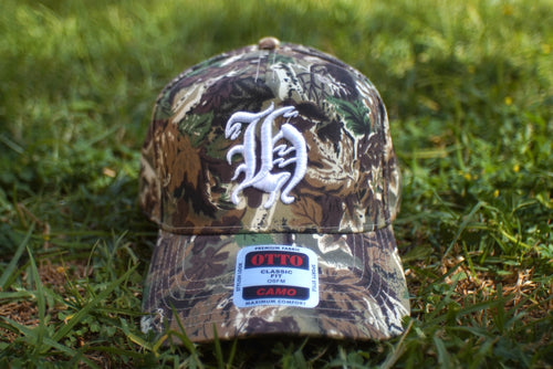 "H" LOGO CAMO TRUCKER HAT