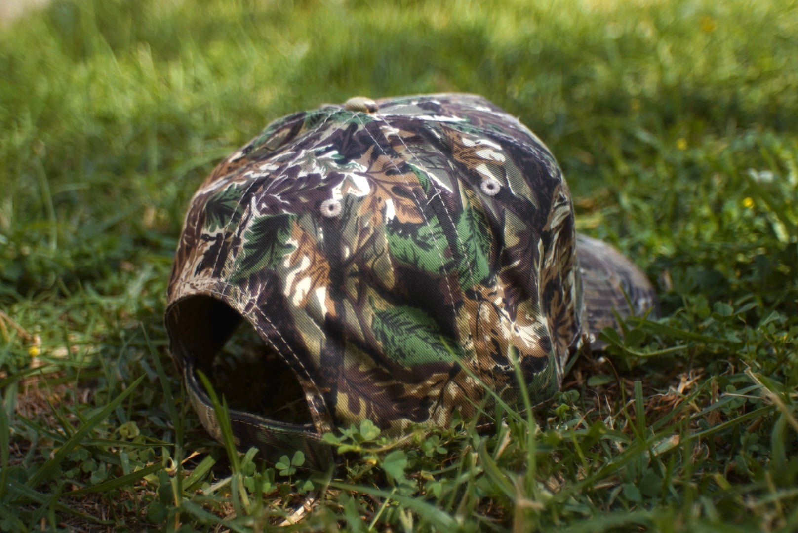 "H" LOGO CAMO TRUCKER HAT